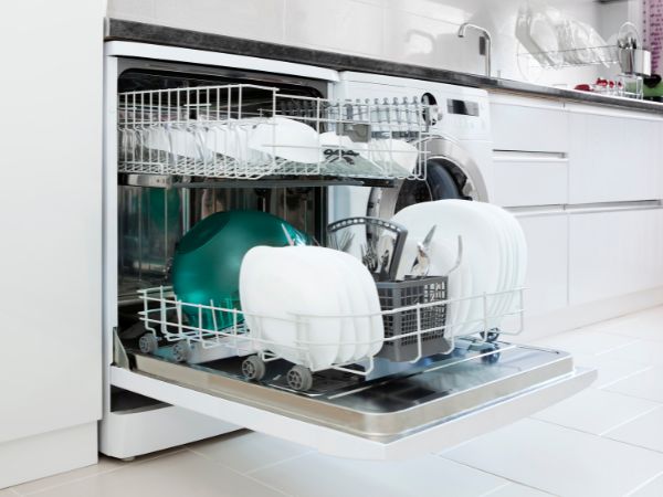 Dishwasher open with clean plates in it