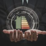 home energy efficiency rating graphic projecting from hands