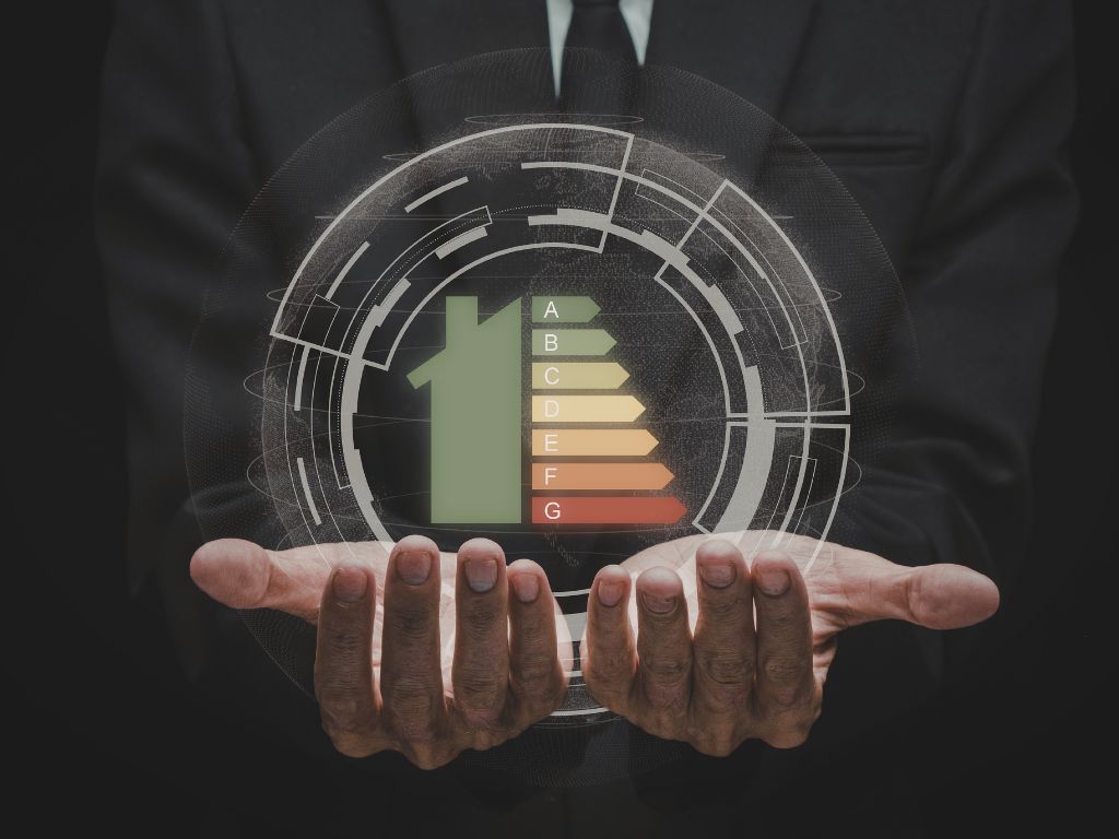 home energy efficiency rating graphic projecting from hands